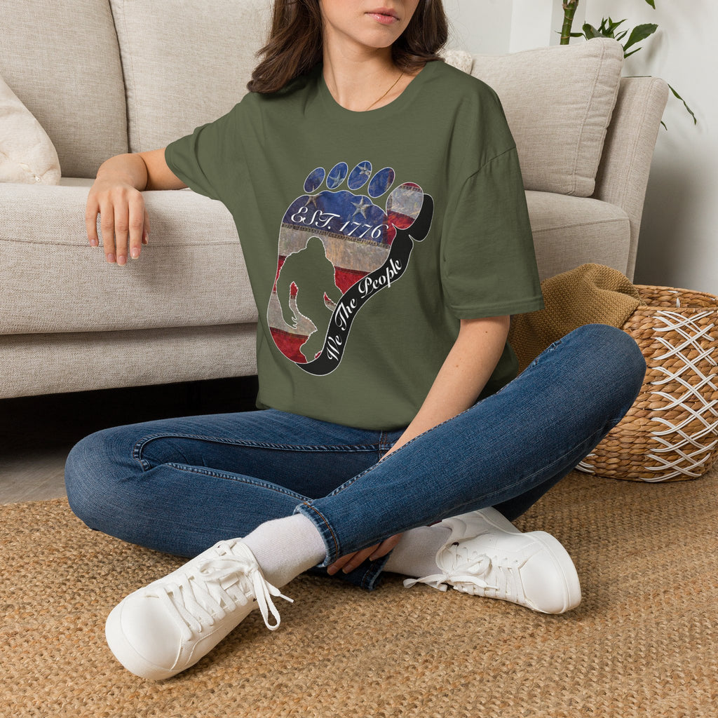 Going Norther Bigfoot T-Shirt — Footprint Silhouette with Distressed Flag "EST. 1776 - We The People"
