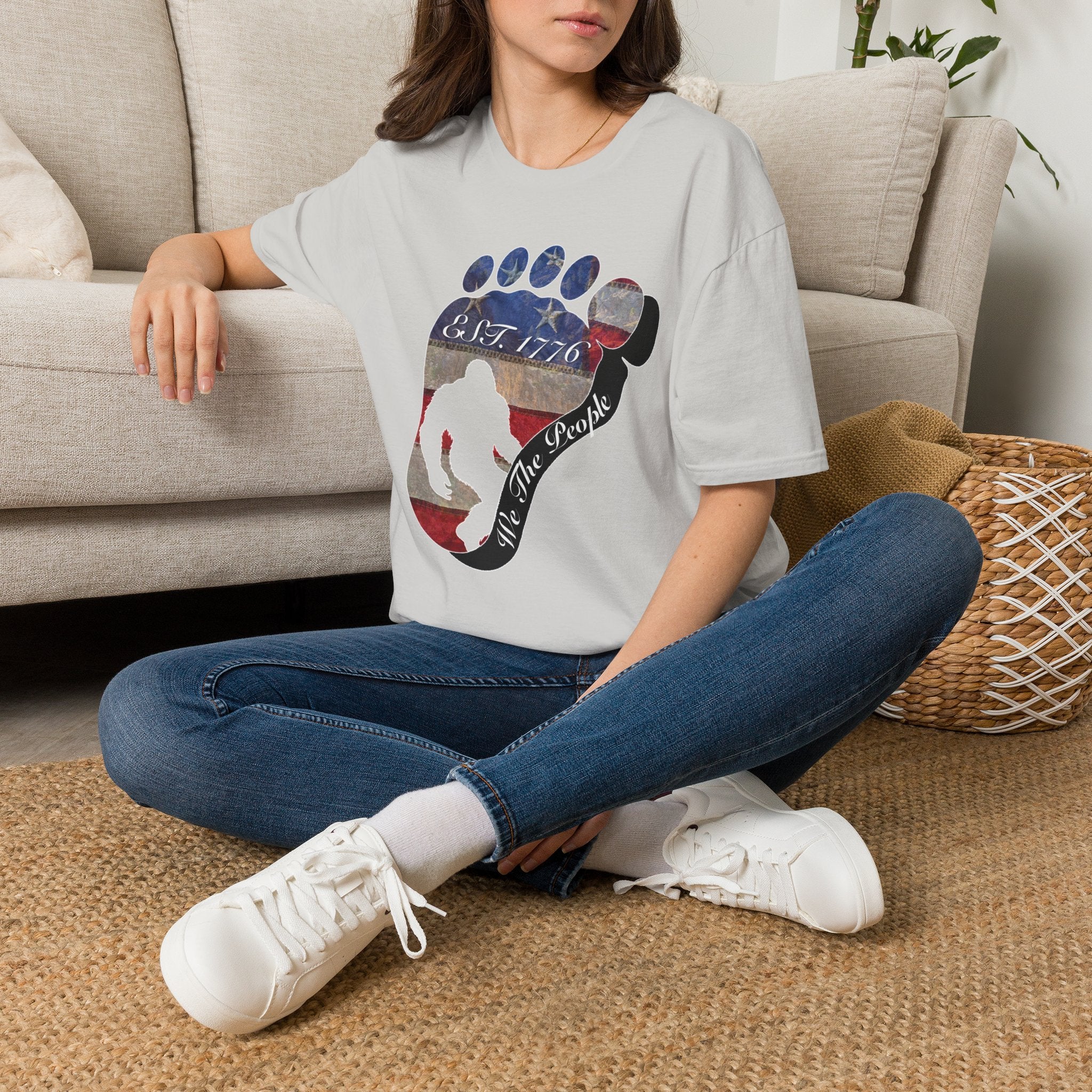 Going Norther Bigfoot T-Shirt — Footprint Silhouette with Distressed Flag "EST. 1776 - We The People"