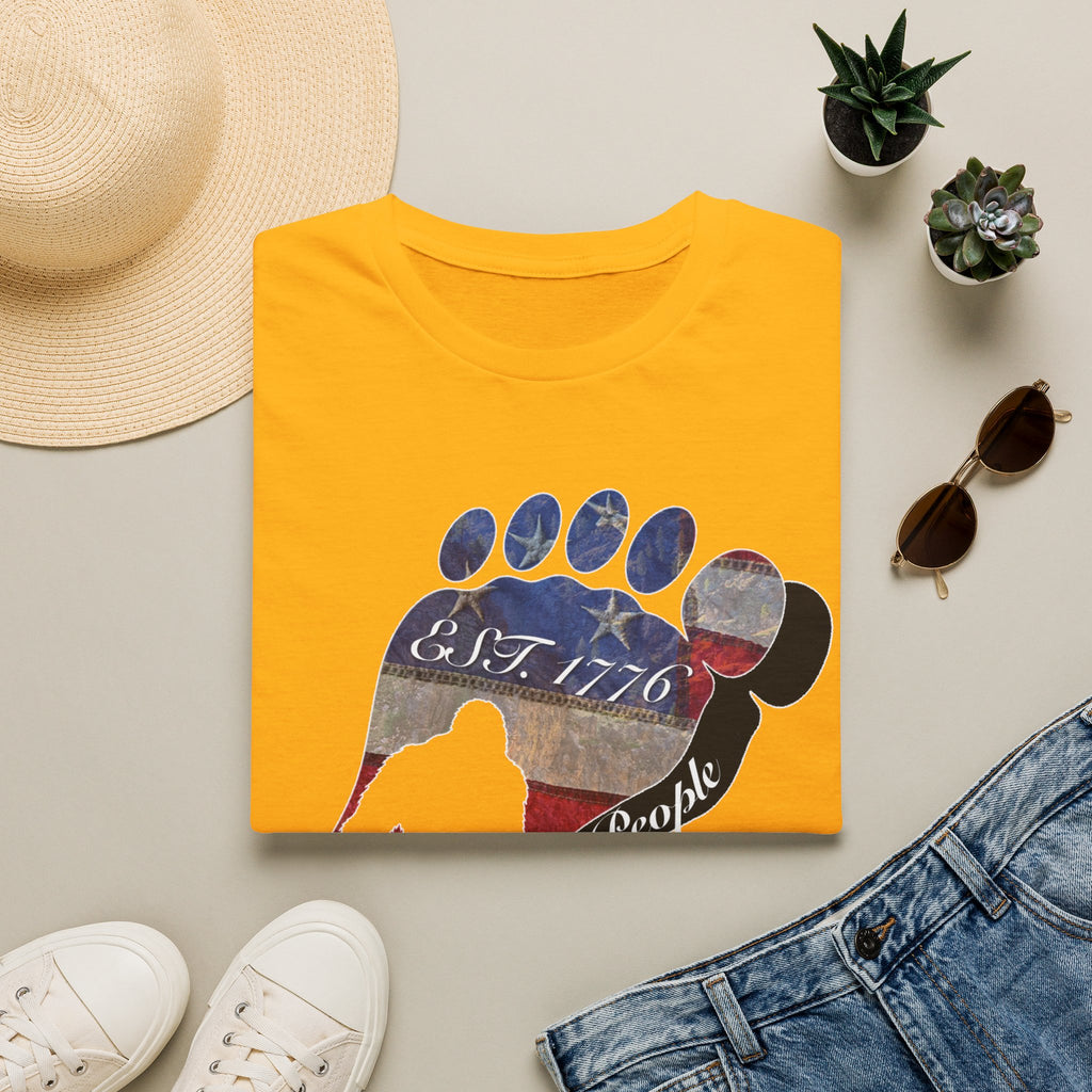 Going Norther Bigfoot T-Shirt — Footprint Silhouette with Distressed Flag "EST. 1776 - We The People"