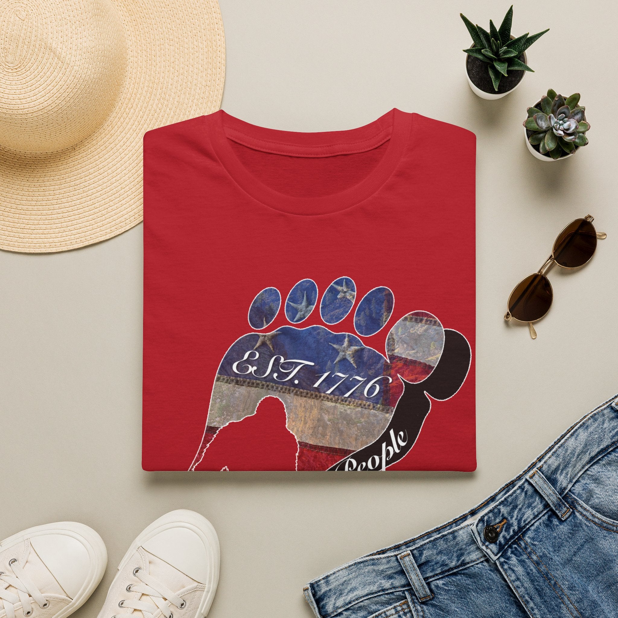 Going Norther Bigfoot T-Shirt — Footprint Silhouette with Distressed Flag "EST. 1776 - We The People"