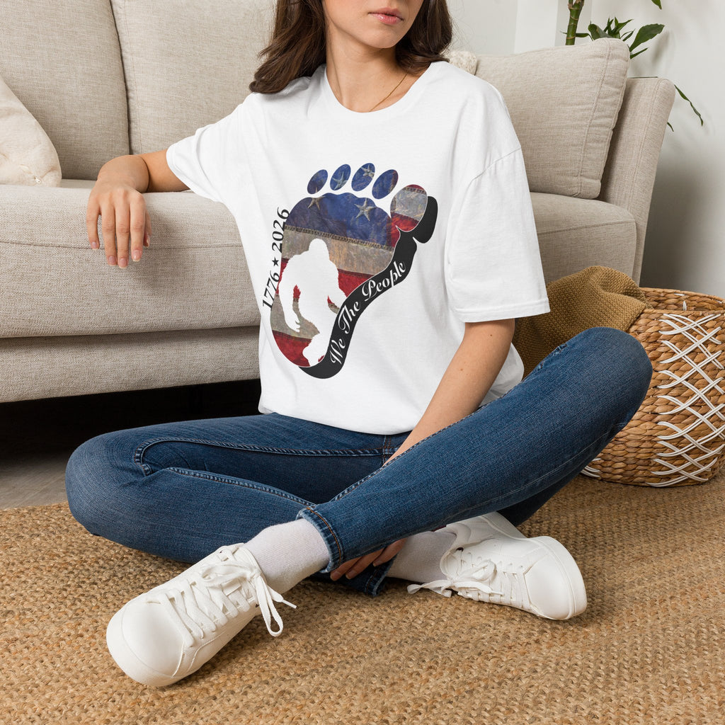 Going Norther Bigfoot T-Shirt — Footprint Silhouette with Distressed Flag & "1776 - 2026 - We The People"