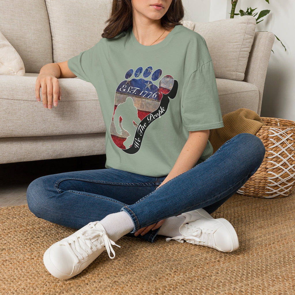 Going Norther Bigfoot T-Shirt — Footprint Silhouette with Distressed Flag "EST. 1776 - We The People"
