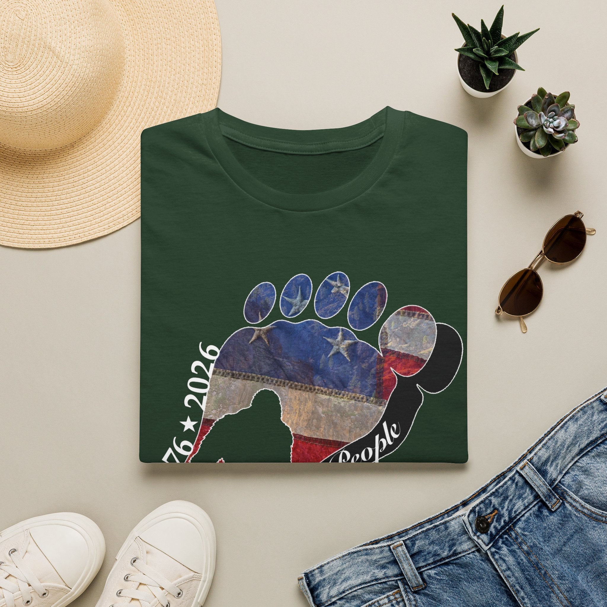 Going Norther Bigfoot T-Shirt — Footprint Silhouette with Distressed Flag & "1776 - 2026 - We The People"