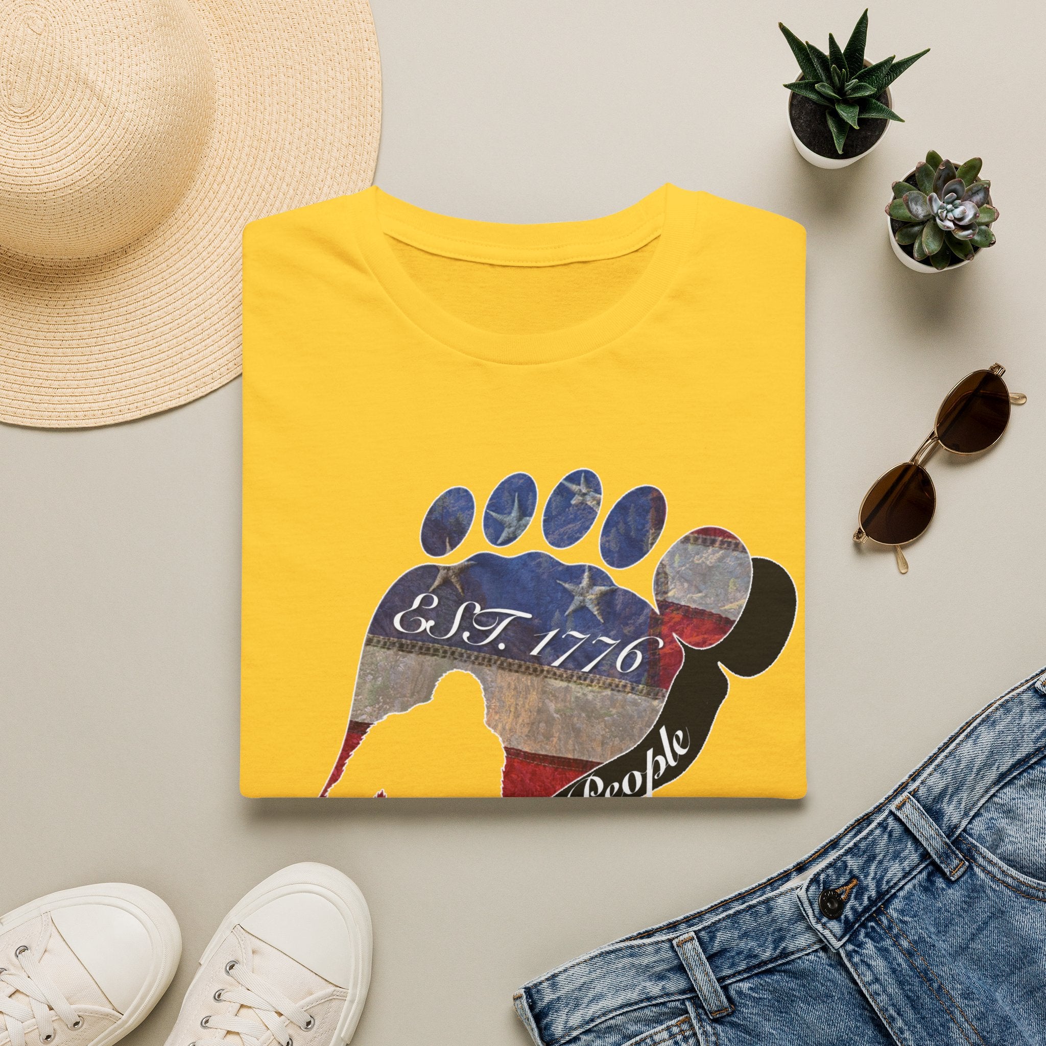 Going Norther Bigfoot T-Shirt — Footprint Silhouette with Distressed Flag "EST. 1776 - We The People"