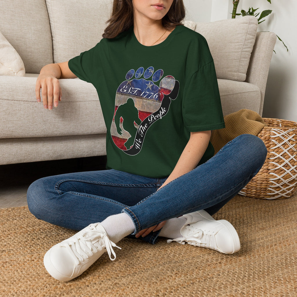 Going Norther Bigfoot T-Shirt — Footprint Silhouette with Distressed Flag "EST. 1776 - We The People"