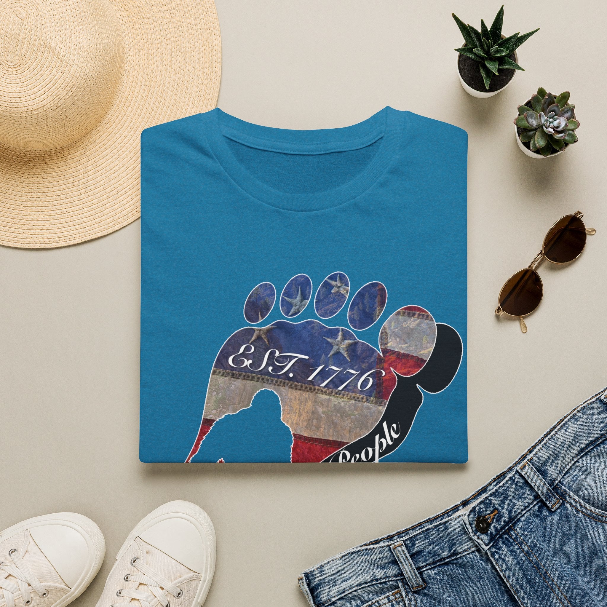 Going Norther Bigfoot T-Shirt — Footprint Silhouette with Distressed Flag "EST. 1776 - We The People"