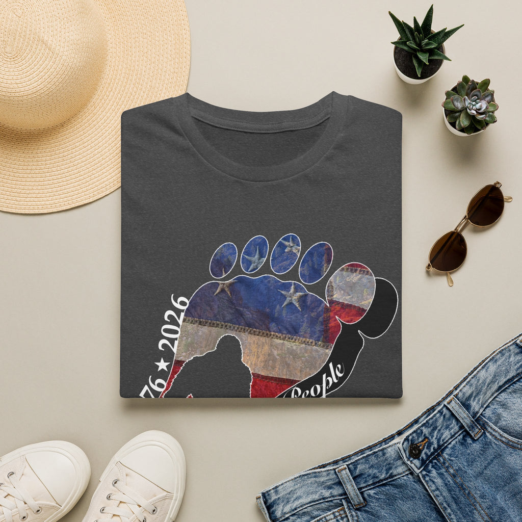 Going Norther Bigfoot T-Shirt — Footprint Silhouette with Distressed Flag & "1776 - 2026 - We The People"