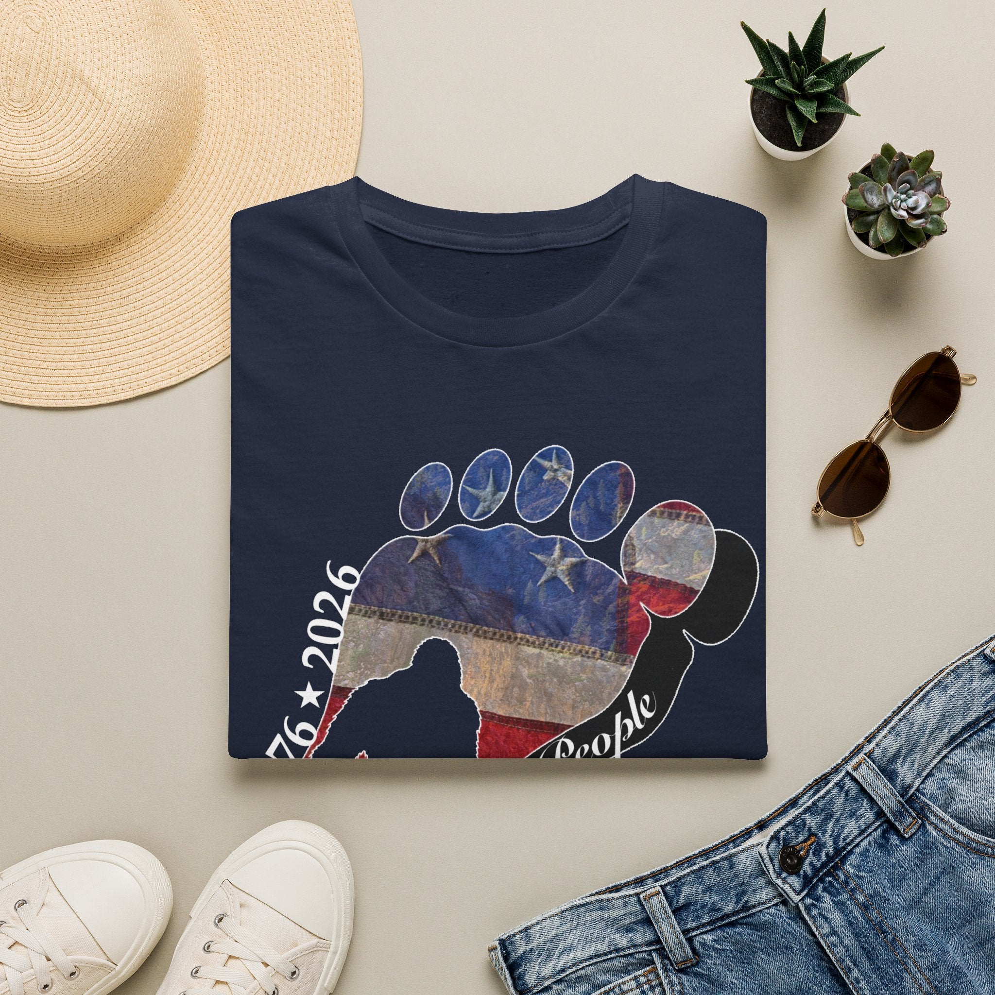 Going Norther Bigfoot T-Shirt — Footprint Silhouette with Distressed Flag & "1776 - 2026 - We The People"