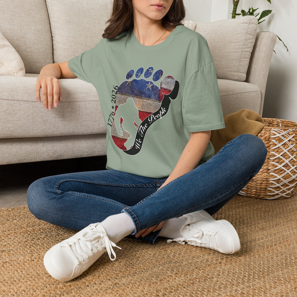 Going Norther Bigfoot T-Shirt — Footprint Silhouette with Distressed Flag & "1776 - 2026 - We The People"