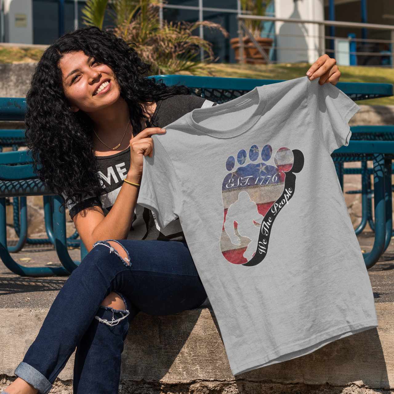 Going Norther Bigfoot T-Shirt — Footprint Silhouette with Distressed Flag "EST. 1776 - We The People"