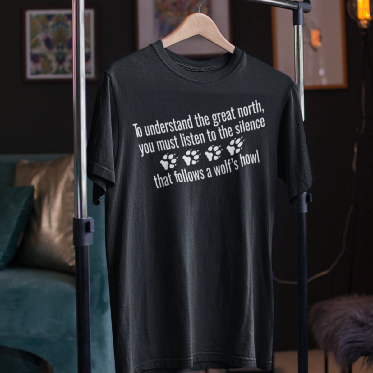 T-Shirt — "To understand the great north, you must listen to the silence that follows a wolf's howl" Paw Print Design